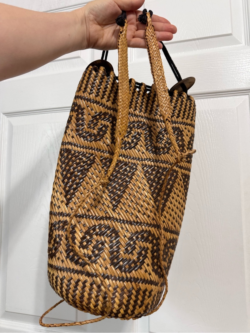 Original woven Natural Rattan Backpack featuring a dayak tribal-inspired.